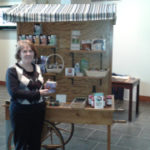 person in front of stand filled with products