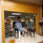 people getting pouring coffee
